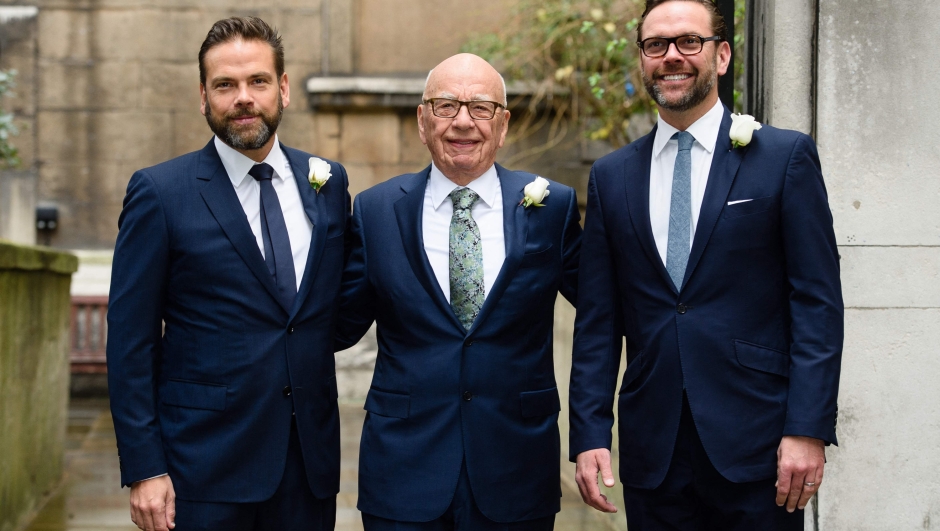 (FILES) Australian born media magnate Rupert Murdoch (C) flanked by his sons Lachlan (L) and James (R) arrive at St Bride's church on Fleet Street in central London on March 5, 2016. Conservative media mogul Rupert Murdoch on November 15, 2023, pledged to maintain an "active role" in the business as he handed control of his global empire to son Lachlan, amid questions about how Fox News will handle next year's presidential election. (Photo by Leon NEAL / AFP)