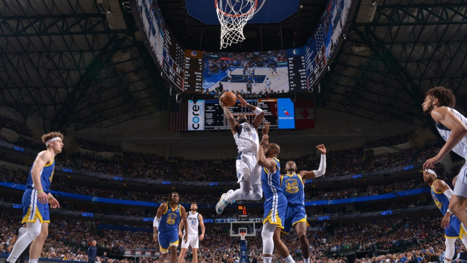 DALLAS, TX - MARCH 13: Kyrie Irving #11 of the Dallas Mavericks drives to the basket during the game against the Golden State Warriors on March 13, 2024 at the American Airlines Center in Dallas, Texas. NOTE TO USER: User expressly acknowledges and agrees that, by downloading and or using this photograph, User is consenting to the terms and conditions of the Getty Images License Agreement. Mandatory Copyright Notice: Copyright 2024 NBAE   Glenn James/NBAE via Getty Images/AFP (Photo by Glenn James / NBAE / Getty Images / Getty Images via AFP)