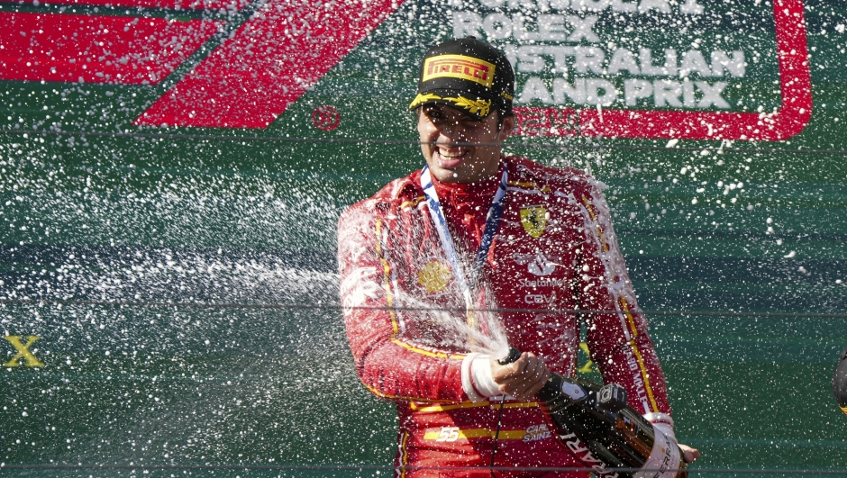 Ferrari driver Carlos Sainz of Spain sprays champagne after winning the Australian Formula One Grand Prix at Albert Park, in Melbourne, Australia, Sunday, March 24, 2024. (AP Photo/Asanka Brendon Ratnayake)