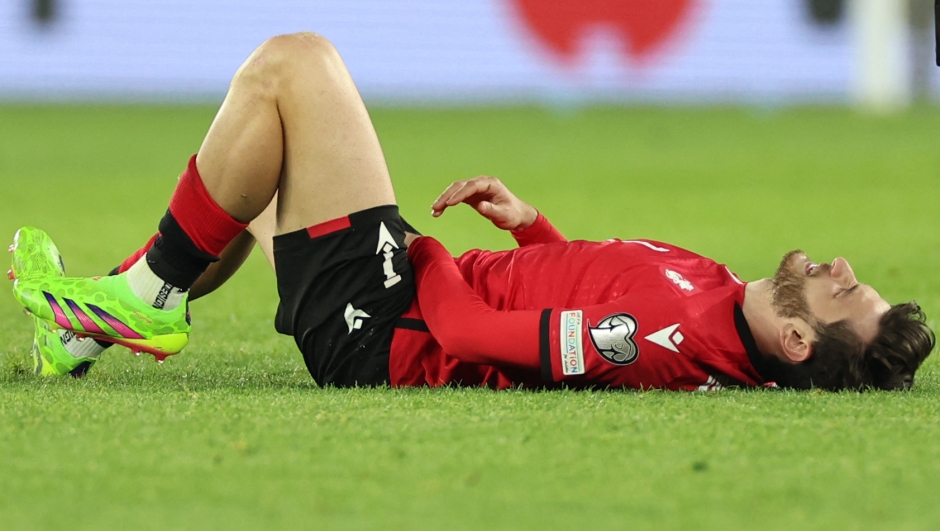 Georgia's midfielder #07 Khvicha Kvaratskhelia reacts in pain during the UEFA EURO 2024 qualifying play-off final football match between Georgia and Greece in Tbilisi on March 26, 2024. (Photo by Giorgi ARJEVANIDZE / AFP)