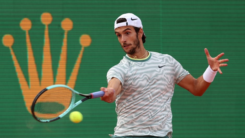 MONTE-CARLO, MONACO - APRIL 07:  Lorenzo Musetti of Italy in action against Taylor Fritz of USA in the first round during day one of the Rolex Monte-Carlo Masters at Monte-Carlo Country Club on April 07, 2024 in Monte-Carlo, Monaco. (Photo by Julian Finney/Getty Images)