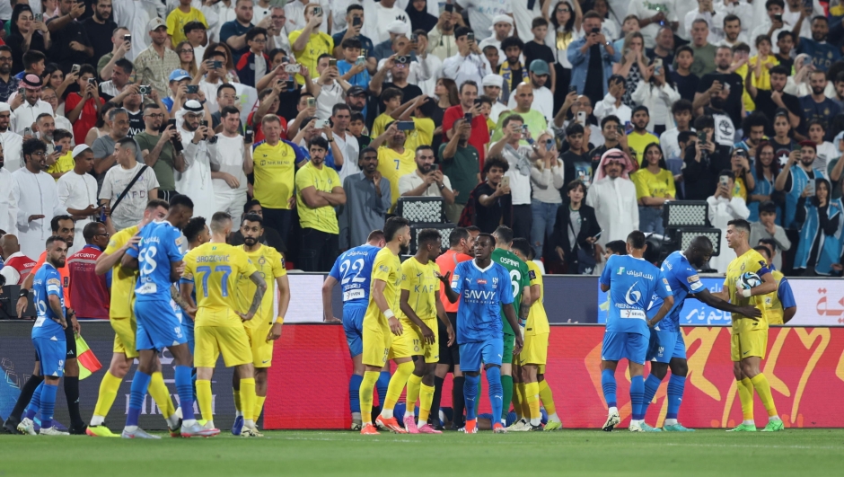 epa11266552 Cristiano Ronaldo (R) of Al-Nassr reacts after clashing during the semifinal soccer match of the Saudi Super Cup between Al-Hilal and Al-Nassr in Abu Dhabi, United Arab Emirates, 08 April 2024.  EPA/ALI HAIDER