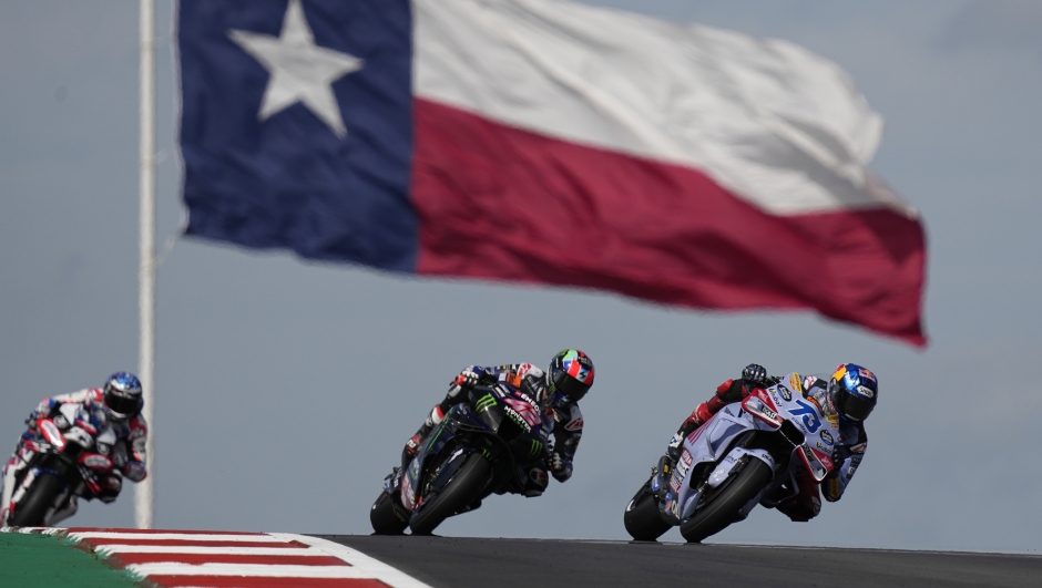 MotoGP rider Alex Marquez (73), of Spain, and Alex Rins (42), of Spain, steer into a turn during qualifying for the MotoGP Grand Prix of the Americas motorcycle race at the Circuit of the Americas, Saturday, April 13, 2023, in Austin, Texas. (AP Photo/Eric Gay)
