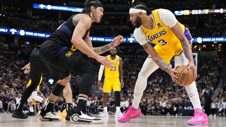 Los Angeles Lakers forward Anthony Davis (3) sets a play against Denver Nuggets forward Aaron Gordon (50) during the second half in Game 2 of an NBA basketball first-round playoff series Monday, April 22, 2024, in Denver. (AP Photo/Jack Dempsey)