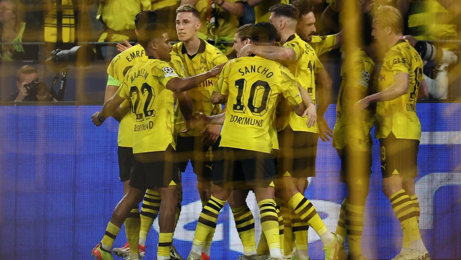Dortmund's German forward #14 Niclas Fuellkrug (R hidden) celebrates scoring the opening goal with team mates during the UEFA Champions League semi-final first leg football match between Borussia Dortmund and Paris Saint-Germain (PSG) in Dortmund, western Germany on May 1, 2024. (Photo by FRANCK FIFE / AFP)