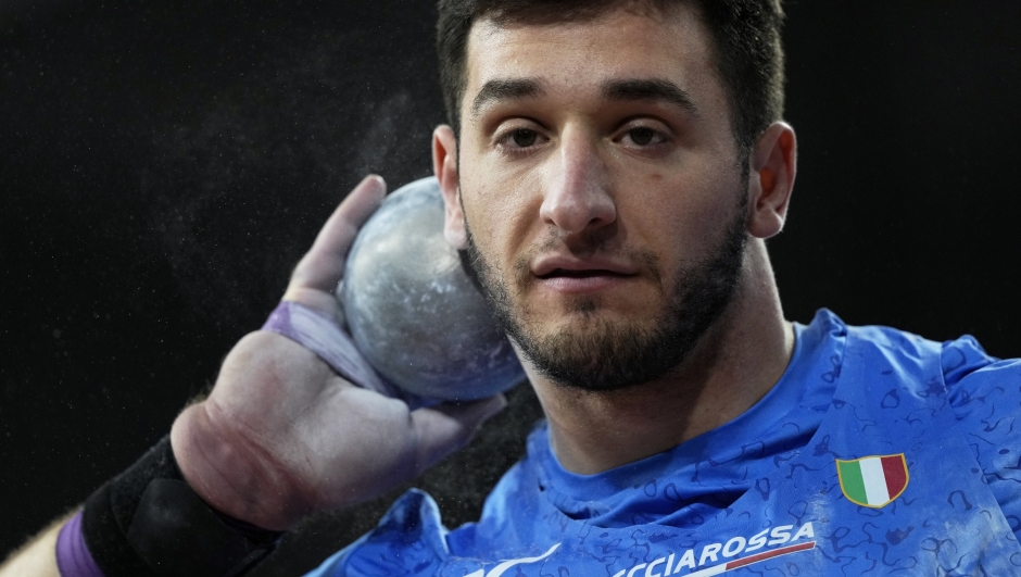 Leonardo Fabbri, of Italy, makes an attempt in the men's shot put during the World Athletics Indoor Championships at the Emirates Arena in Glasgow, Scotland, Friday, March 1, 2024. (AP Photo/Bernat Armangue)