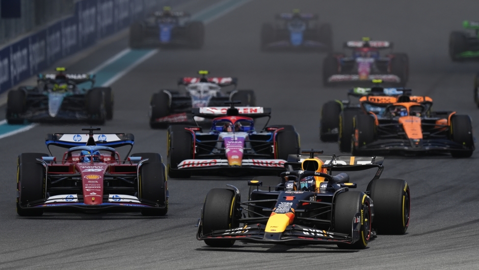 Red Bull driver Max Verstappen of the Netherlands, right, leads the pack, followed by Ferrari driver Charles Leclerc of Monaco, left, at the start of the Sprint race at the Formula One Miami Grand Prix auto race, Saturday, May 4, 2024, in Miami Gardens, Fla. (AP Photo/Rebecca Blackwell)