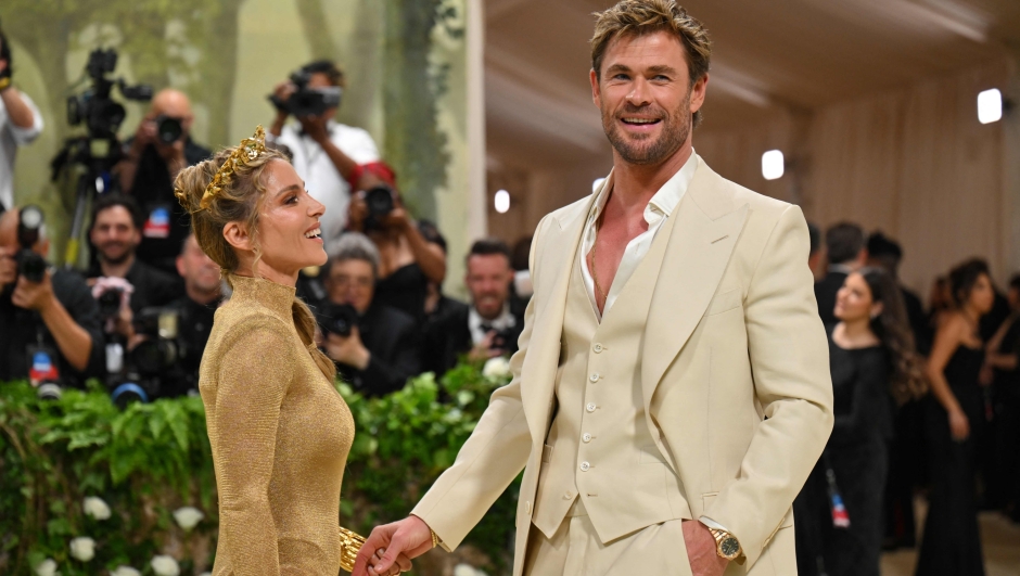 TOPSHOT - Australian actor Chris Hemsworth (R) and wife Spanish model and actress Elsa Pataky arrive for the 2024 Met Gala at the Metropolitan Museum of Art on May 6, 2024, in New York. The Gala raises money for the Metropolitan Museum of Art's Costume Institute. The Gala's 2024 theme is Sleeping Beauties: Reawakening Fashion. (Photo by Angela WEISS / AFP)