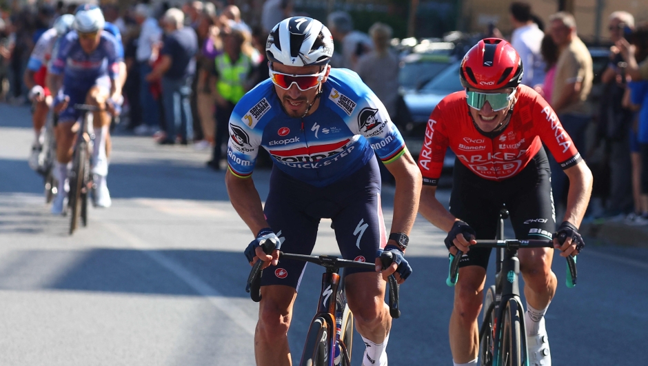 Team Soudal-Quick Step's French rider Julian Alaphilippe (L) and Team Arkea's French rider Ewen Costiou ride ahead during the 9th stage of the 107th Giro d'Italia cycling race, 214km between Avezzano and Naples, on May 12, 2024. (Photo by Luca Bettini / AFP)