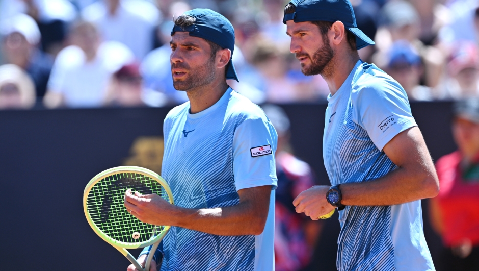 ROME, ITALY - MAY 14: Simone Bolelli and Andrea Vavassori of Italy interact during their Men's Doubles Round of 16 match against Rohan Bopanna of India and Matthew Ebden of Australia on Day Nine of Internazionali BNL D'Italia at Foro Italico on May 14, 2024 in Rome, Italy. (Photo by Mike Hewitt/Getty Images)