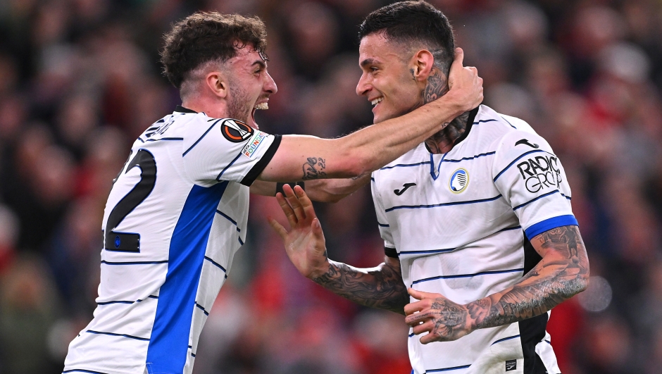 LIVERPOOL, ENGLAND - APRIL 11: Gianluca Scamacca of Atalanta BC celebrates with Matteo Ruggeri of Atalanta BC after scoring his team's first goal during the UEFA Europa League 2023/24 Quarter-Final first leg match between Liverpool FC and Atalanta at Anfield on April 11, 2024 in Liverpool, England. (Photo by Stu Forster/Getty Images)