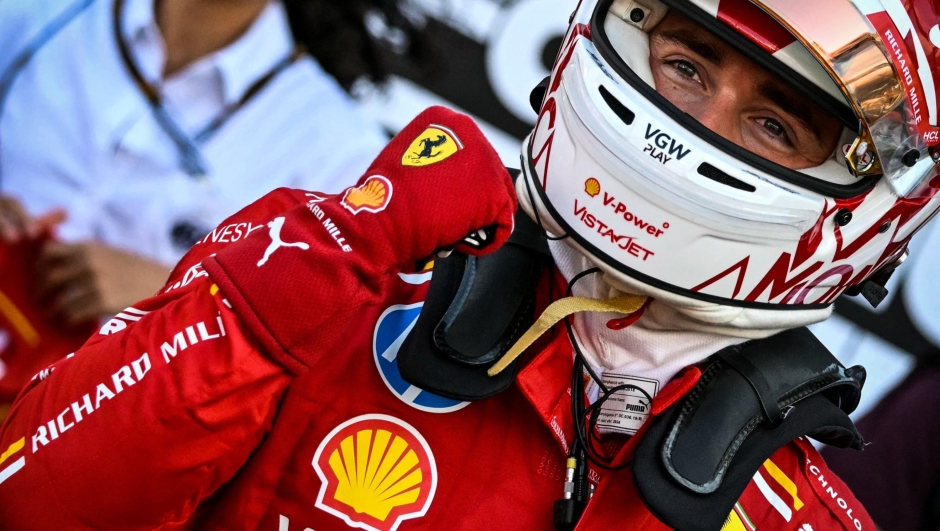 TOPSHOT - Ferrari's Monegasque driver Charles Leclerc celebrates after winning the qualifying session of the Formula One Monaco Grand Prix on May 25 2024 at the Circuit de Monaco, on the eve of the race. (Photo by ANDREJ ISAKOVIC / AFP)