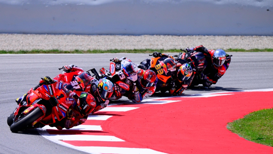 (From L) Ducati Italian rider Francesco Bagnaia, KTM Spanish rider Pedro Acosta, Aprilia Spanish rider Raul Fernandez, KTM South African rider Brad Binder compete in the MotoGP Sprint Race of the Moto Grand Prix of Catalonia at the Circuit de Catalunya on May 25, 2024 in Montmelo on the outskirts of Barcelona. (Photo by Josep LAGO / AFP)