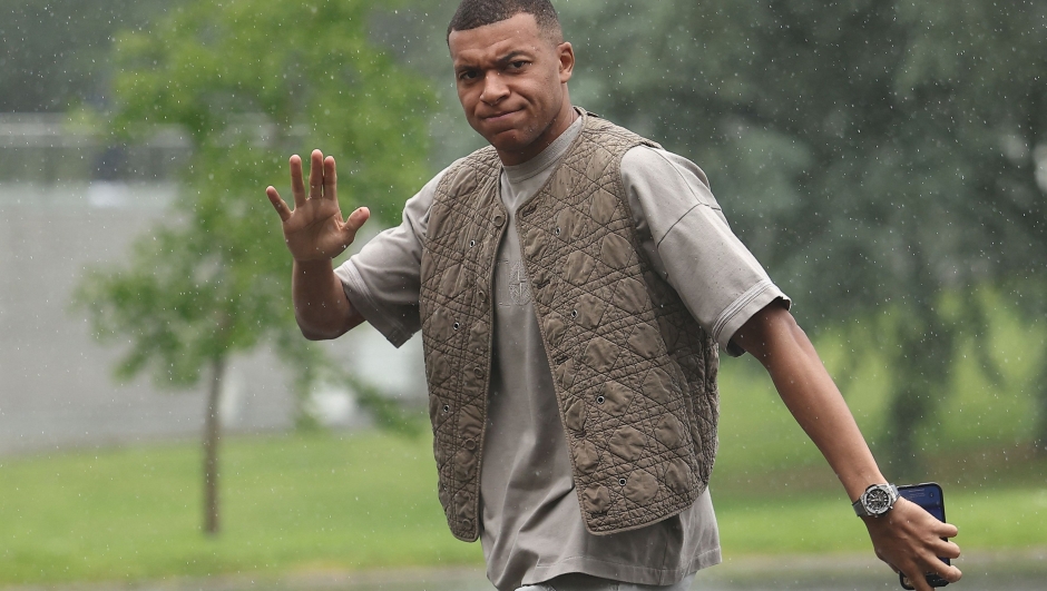 France's forward Kylian Mbappe arrives to the national team's training camp for the upcoming UEFA Euro 2024 European Football Championship, in Clairefontaine-en-Yvelines on May 29, 2024. (Photo by FRANCK FIFE / AFP)