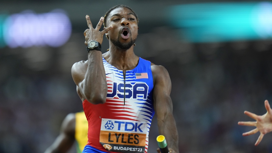 Noah Lyles, of the United States celebrates anchoring his team to gold in the Men's 4x100-meters relay final during the World Athletics Championships in Budapest, Hungary, Saturday, Aug. 26, 2023. (AP Photo/Petr David Josek)