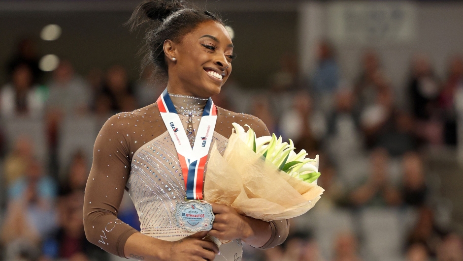 FORT WORTH, TEXAS - JUNE 02: First place all around winner Simone Biles celebrates after the 2024 Xfinity U.S. Gymnastics Championships at Dickies Arena on June 02, 2024 in Fort Worth, Texas.   Elsa/Getty Images/AFP (Photo by ELSA / GETTY IMAGES NORTH AMERICA / Getty Images via AFP)