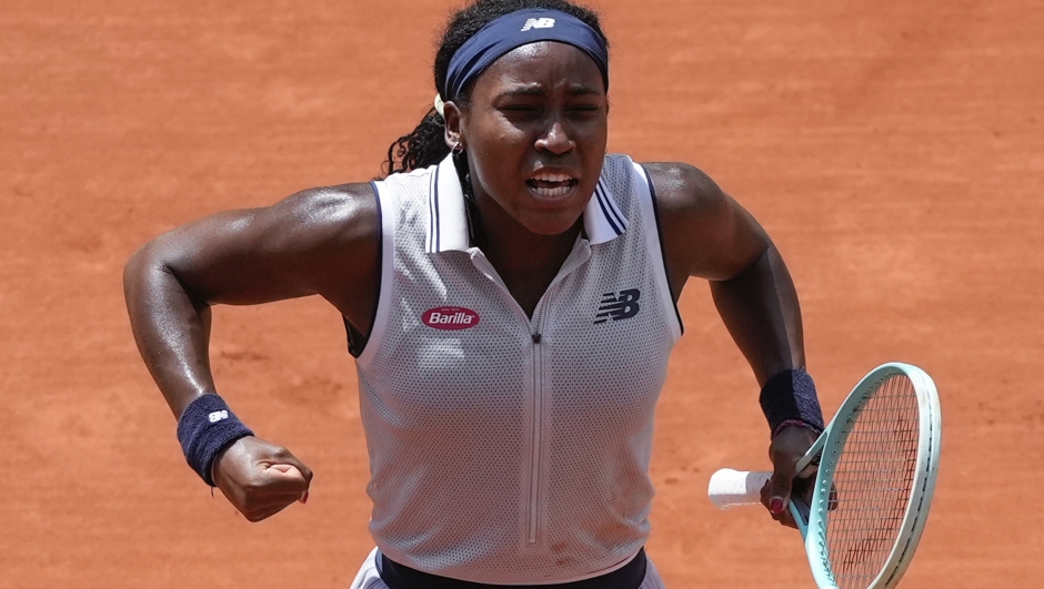 Coco Gauff of the U.S. celebrates winning her quarterfinal match of the French Open tennis tournament against Tunisia's Ons Jabeur at the Roland Garros stadium in Paris, Tuesday, June 4, 2024. (AP Photo/Thibault Camus)