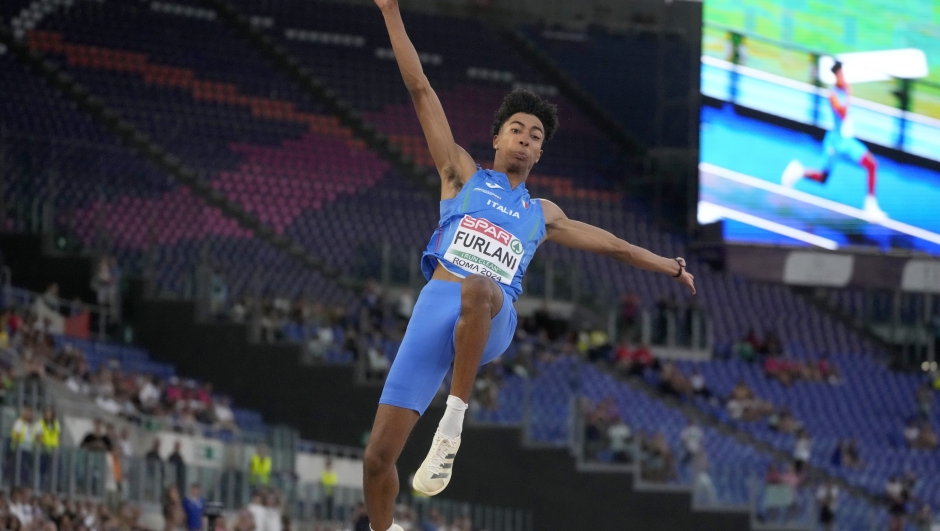 Mattia Furlani, of Italy, makes an attempt in the men's long jump final at the the European Athletics Championships in Rome, Saturday, June 8, 2024. (AP Photo/Gregorio Borgia)