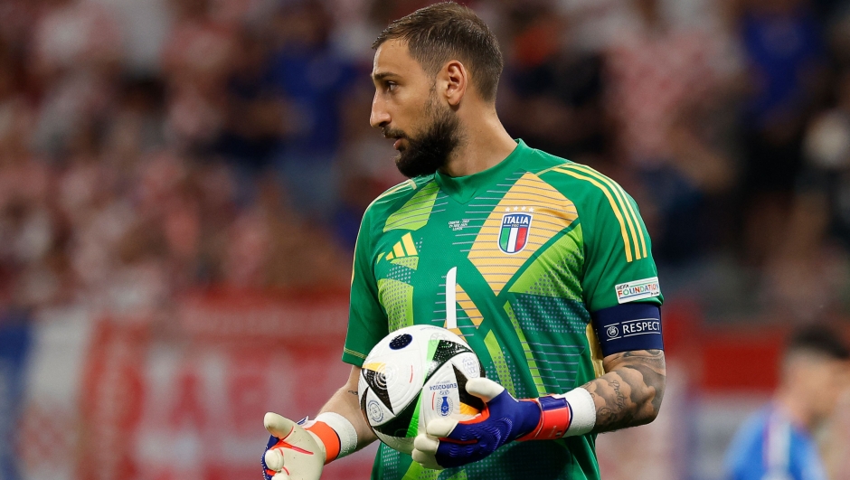 Italy's goalkeeper #01 Gianluigi Donnarumma holds the ball during the UEFA Euro 2024 Group B football match between Croatia and Italy at the Leipzig Stadium in Leipzig on June 24, 2024. (Photo by Odd ANDERSEN / AFP)
