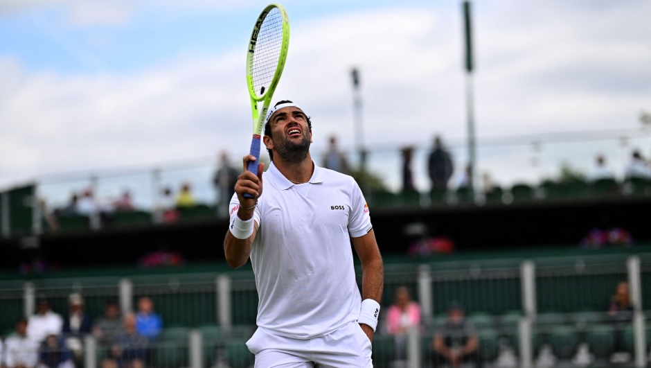 Italy's Matteo Berrettini reacts against Hungary's Marton Fucsovics during their men's singles tennis match on the first day of the 2024 Wimbledon Championships at The All England Lawn Tennis and Croquet Club in Wimbledon, southwest London, on July 1, 2024. (Photo by ANDREJ ISAKOVIC / AFP) / RESTRICTED TO EDITORIAL USE
