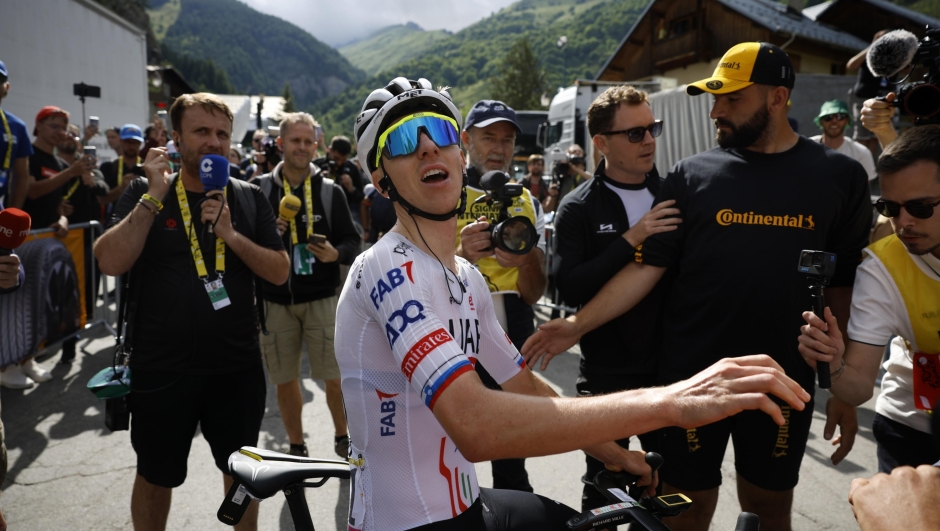 epa11452670 Slovenian rider Tadej Pogacar of UAE Team Emirates reacts after crossing the finish line to win the fourth stage of the 2024 Tour de France cycling race over 139km from Pinerolo to Valloire, France, 02 July 2024.  EPA/STEPHANE MAHE / POOL