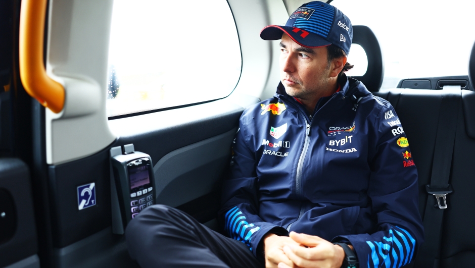 NORTHAMPTON, ENGLAND - JULY 06: Sergio Perez of Mexico and Oracle Red Bull Racing looks on from a black cab in the Paddock prior to final practice ahead of the F1 Grand Prix of Great Britain at Silverstone Circuit on July 06, 2024 in Northampton, England. (Photo by Mark Thompson/Getty Images)