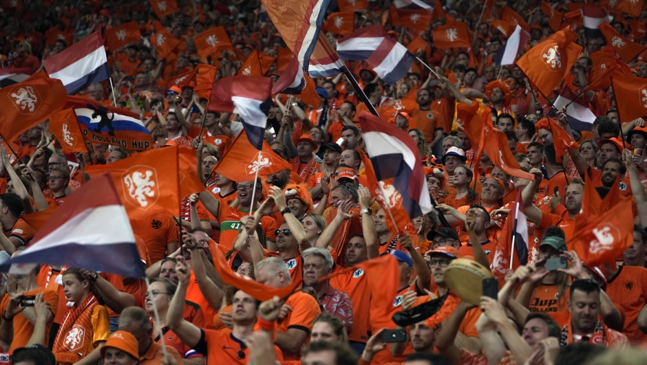 Dutch supporters cheer prior to a semifinal match between the Netherlands and England at the Euro 2024 soccer tournament in Dortmund, Germany, Wednesday, July 10, 2024. (AP Photo/Darko Vojinovic)