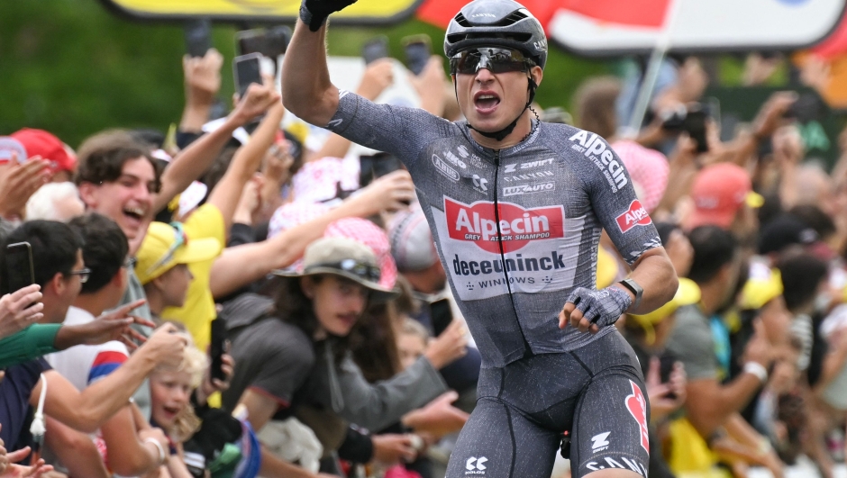 Alpecin-Deceuninck team's Belgian rider Jasper Philipsen cycles to the finish line to win the 13th stage of the 111th edition of the Tour de France cycling race, 165,3 km between Agen and Pau, southwestern France, on July 12, 2024. (Photo by Marco BERTORELLO / AFP)