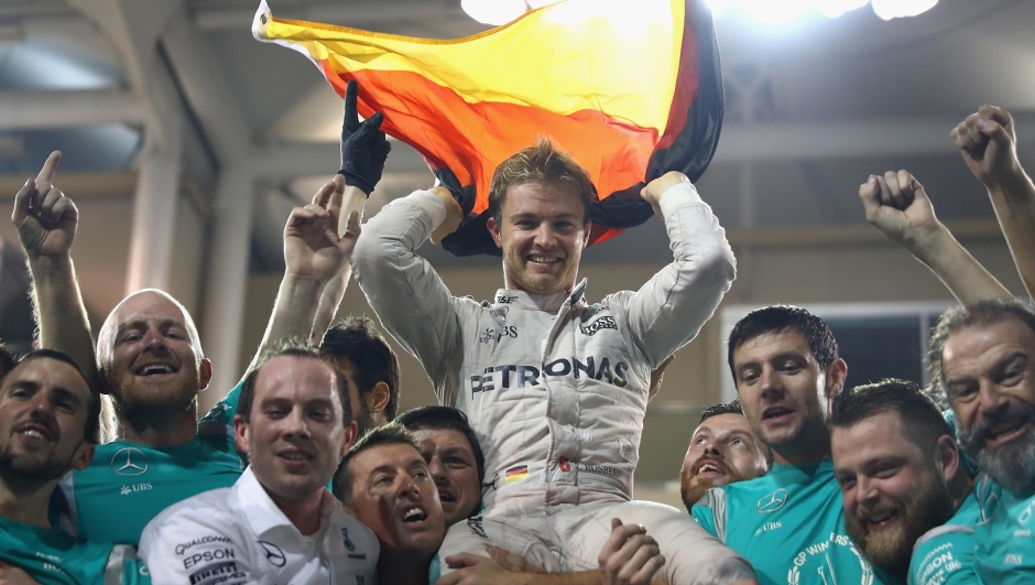 ABU DHABI, UNITED ARAB EMIRATES - NOVEMBER 27:  Nico Rosberg of Germany and Mercedes GP celebrates with his team after finishing second and securing the F1 World Drivers Championship during the Abu Dhabi Formula One Grand Prix at Yas Marina Circuit on November 27, 2016 in Abu Dhabi, United Arab Emirates.  (Photo by Clive Mason/Getty Images)