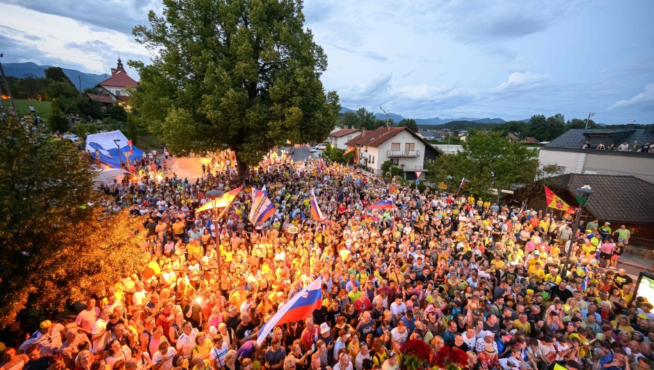 Fans of Slovenian cyclist Tadej Pogacar gather for a reception to celebrate his wins at the Giro dItalia and Tour de France at his hometown in Komenda on July 24, 2024. (Photo by Jure Makovec / AFP)