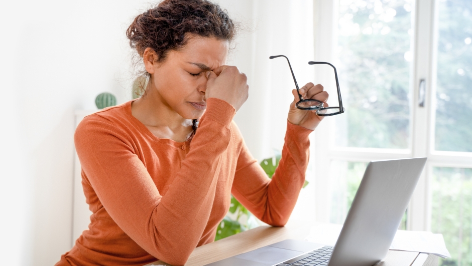 Black woman is suffering eyestrain and headache