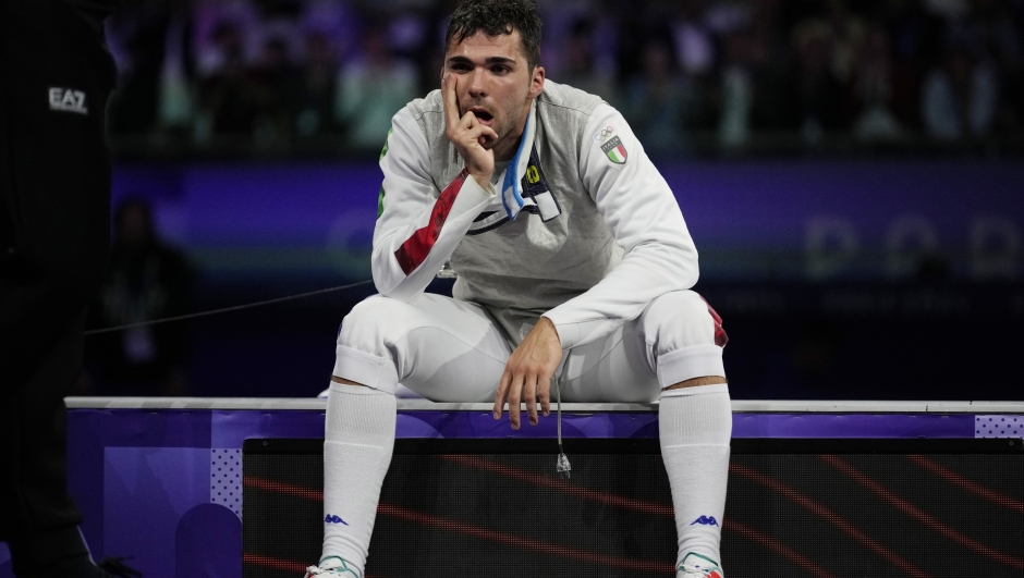 Italy's Filippo Macchi reacts after loosing the men's individual Foil final match against Hong Kong's Cheung Ka long during the 2024 Summer Olympics at the Grand Palais, Monday, July 29, 2024, in Paris, France. (AP Photo/Andrew Medichini)