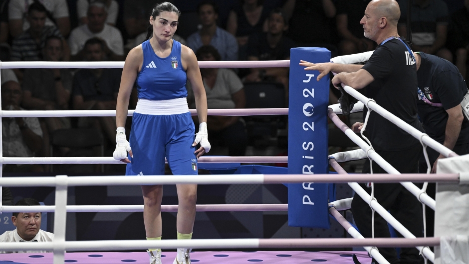 Imane Khelif  of Algeria  (unseen) and Angela Carini  of Italy ( Blue) in action during their women's 66kg preliminar round of 16 bout of the Boxing competitions in the Paris 2024 Olympic Games, at the North Paris Arena in Villepinte, France,  1 August 2024 . ANSA / CIRO FUSCO