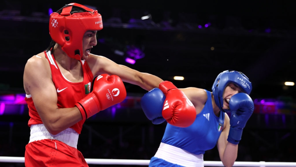 PARIS, FRANCE - AUGUST 01: Imane Khelif of Team Algeria and Angela Carini of Team Italy exchange punches during the Women's 66kg preliminary round match on day six of the Olympic Games Paris 2024 at North Paris Arena on August 01, 2024 in Paris, France. (Photo by Richard Pelham/Getty Images)