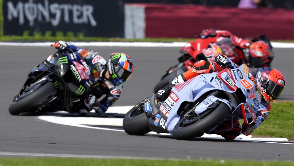 epa11518876 Spanish rider Marc Marquez (R) of Gresini Racing team in action during the MotoGP Free Practice session at the Motorcycling Grand Prix of Great Britain at the Silverstone race track, in Silverstone, Britain, 02 August 2024. The 2024 British Grand Prix takes place from 02 to 04 August 2024.  EPA/TIM KEETON