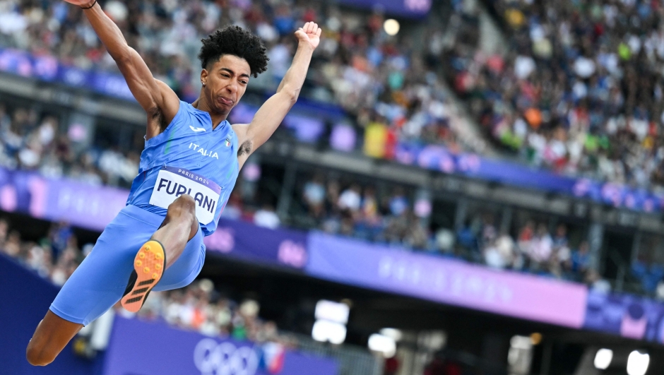 Italy's Mattia Furlani competes in the men's long jump qualification of the athletics event at the Paris 2024 Olympic Games at Stade de France in Saint-Denis, north of Paris, on August 4, 2024. (Photo by Andrej ISAKOVIC / AFP)