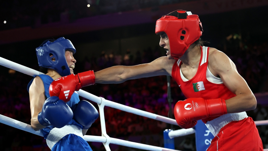 PARIS, FRANCE - AUGUST 09: Imane Khelif of Team Algeria punches Liu Yang of Team People's Republic of China during the Boxing Women's 66kg Final match on day fourteen of the Olympic Games Paris 2024 at Roland Garros on August 09, 2024 in Paris, France. (Photo by Richard Pelham/Getty Images)