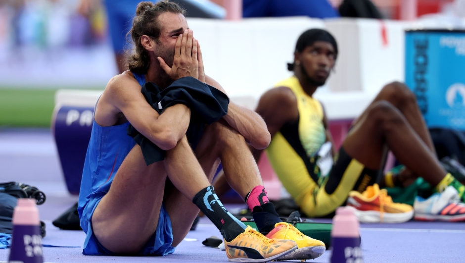 PARIS, FRANCE - AUGUST 10: Gianmarco Tamberi of Team Italy shows his dejection after competing in the Men's High Jump Final on day fifteen of the Olympic Games Paris 2024 at Stade de France on August 10, 2024 in Paris, France. (Photo by Al Bello/Getty Images)