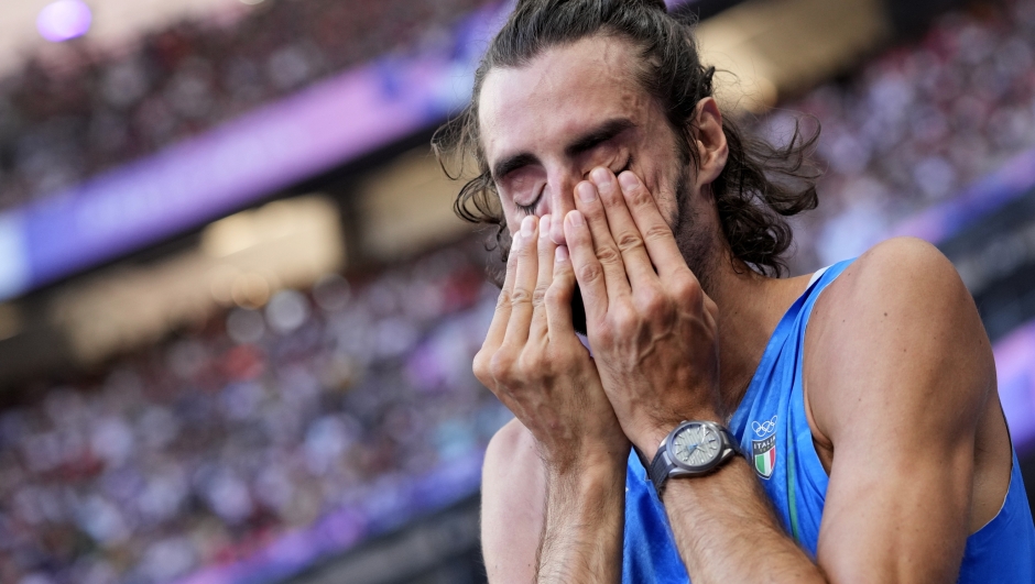 Gianmarco Tamberi, of Italy, reacts after competing in the men's high jump final at the 2024 Summer Olympics, Saturday, Aug. 10, 2024, in Saint-Denis, France. (AP Photo/Bernat Armangue)