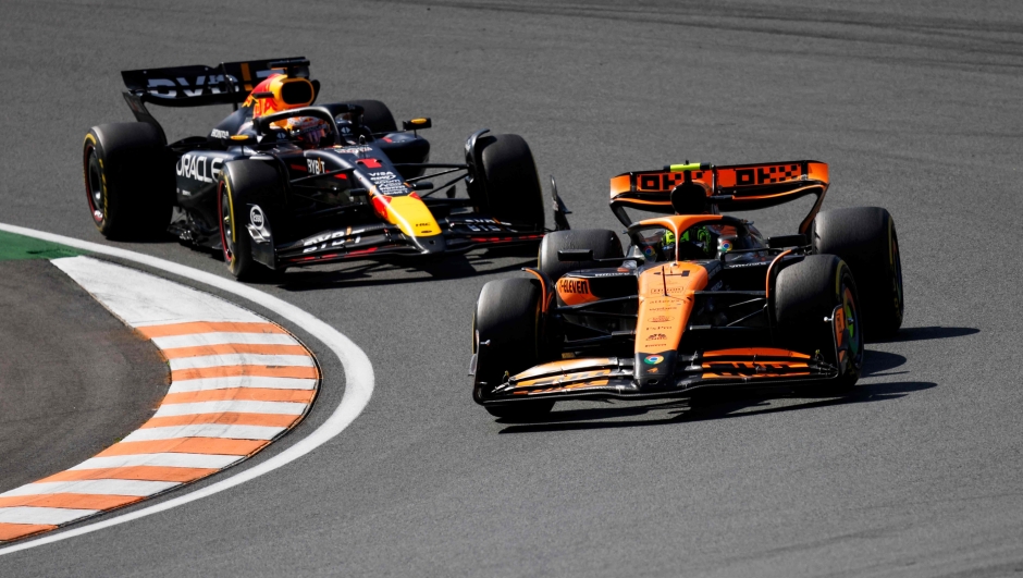 McLaren's British driver Lando Norris drives in front of Red Bull Racing's Dutch driver Max Verstappen during the Formula One Dutch Grand Prix at The Circuit Zandvoort, western Netherlands, on August 25, 2024. (Photo by SIMON WOHLFAHRT / AFP)