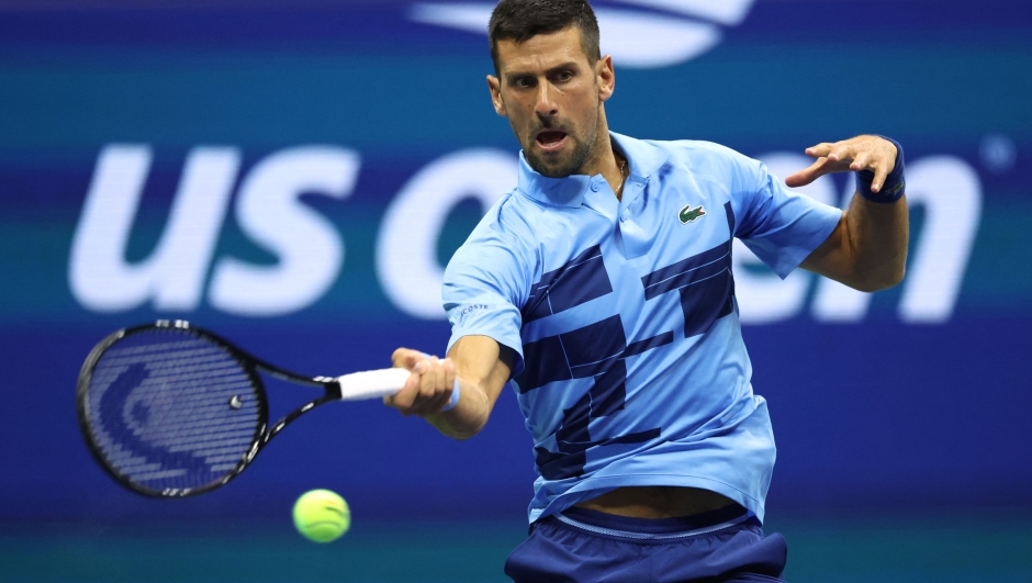 Serbia's Novak Djokovic returns the ball to Moldova's Radu Albot during their men's singles first round tennis match on day one of the US Open tennis tournament at the USTA Billie Jean King National Tennis Center in New York City, on August 26, 2024. (Photo by CHARLY TRIBALLEAU / AFP)