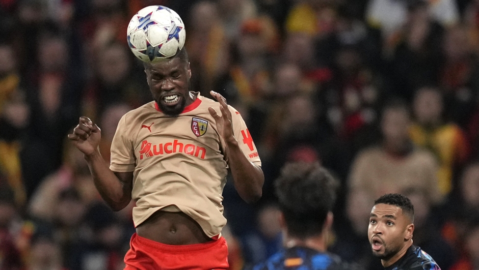 Lens' Kevin Danso heads the ball during the Champions League Group B soccer match between Lens and Sevilla at the Bollaert stadium in Lens, France, Tuesday, Dec. 12, 2023. (AP Photo/Thibault Camus)