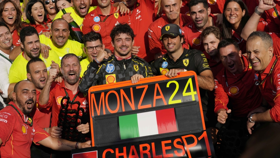 Ferrari driver Charles Leclerc of Monaco celebrates with his teammate Ferrari driver Carlos Sainz of Spain in the Ferrari garage after winning the Italy's Formula One Grand Prix at the Monza racetrack, in Monza, Italy, Sunday, Sep.1, 2024 (AP Photo/Luca Bruno)