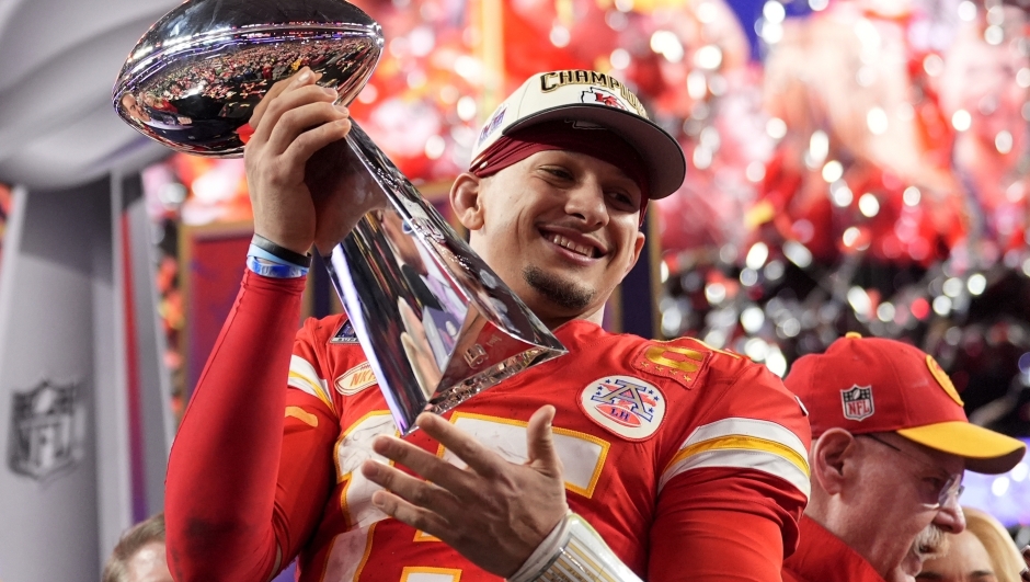 FILE - Kansas City Chiefs quarterback Patrick Mahomes celebrates with the trophy after the team's win in overtime during the NFL Super Bowl 58 football game against the San Francisco 49ers, Sunday, Feb. 11, 2024, in Las Vegas. Mahomes and the Chiefs are aiming to become the first team to three-peat since the 1965-67 Green Bay Packers won three consecutive NFL championships. (AP Photo/Ashley Landis, File)