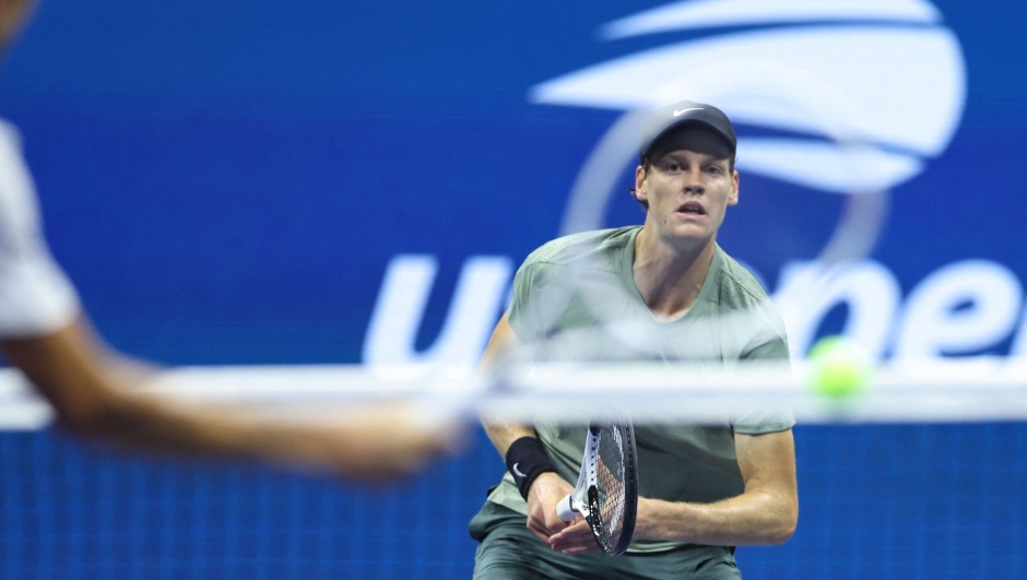 Italy's Jannik Sinner eyes the ball during the men's quarterfinals match against Russia's Daniil Medvedev (L) on day ten of the US Open tennis tournament at the USTA Billie Jean King National Tennis Center in New York City, on September 4, 2024. (Photo by CHARLY TRIBALLEAU / AFP)