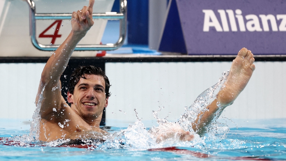 Italy's Simone Barlaam celebrates his victory in the  men's S9 50m freestyle final event at the Paris 2024 Paralympic Games at The Paris La Defense Arena in Nanterre, west of Paris, on September 02, 2024. (Photo by FRANCK FIFE / AFP)