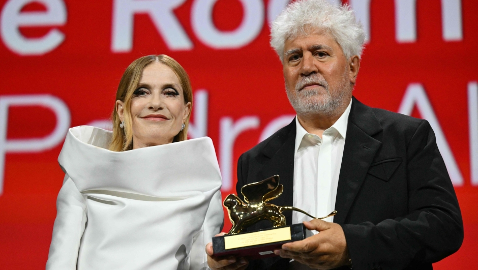 Spanish director Pedro Almodovar poses next to French actress and president of the jury Isabelle Huppert with the Golden Lion for Best Film he reveived for 'The Room Next Door' during the award ceremony of the 81st Venice Film Festival on September 7, 2024 at Venice Lido. (Photo by Alberto PIZZOLI / AFP)