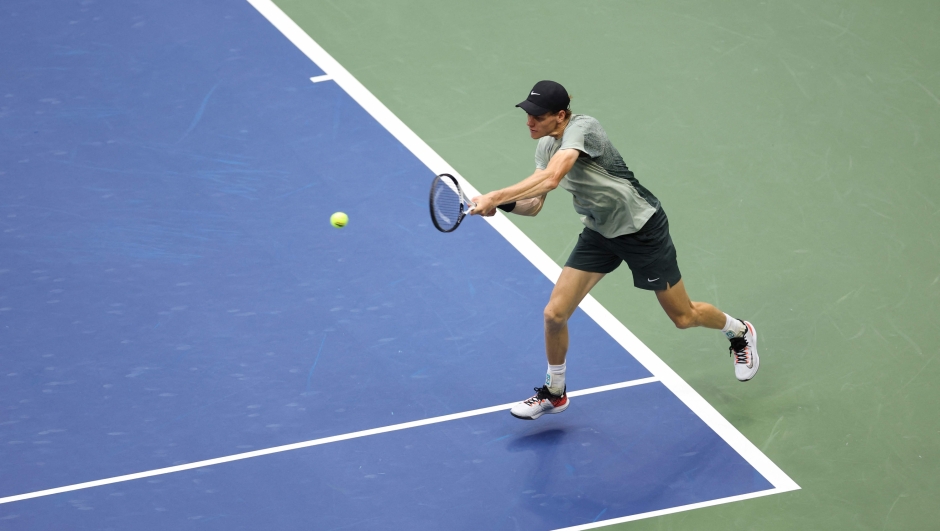 Italy's Jannik Sinner hits a return to Britain's Jack Draper during their men's semifinals match on day twelve of the US Open tennis tournament at the USTA Billie Jean King National Tennis Center in New York City, on September 6, 2024. (Photo by CHARLY TRIBALLEAU / AFP)