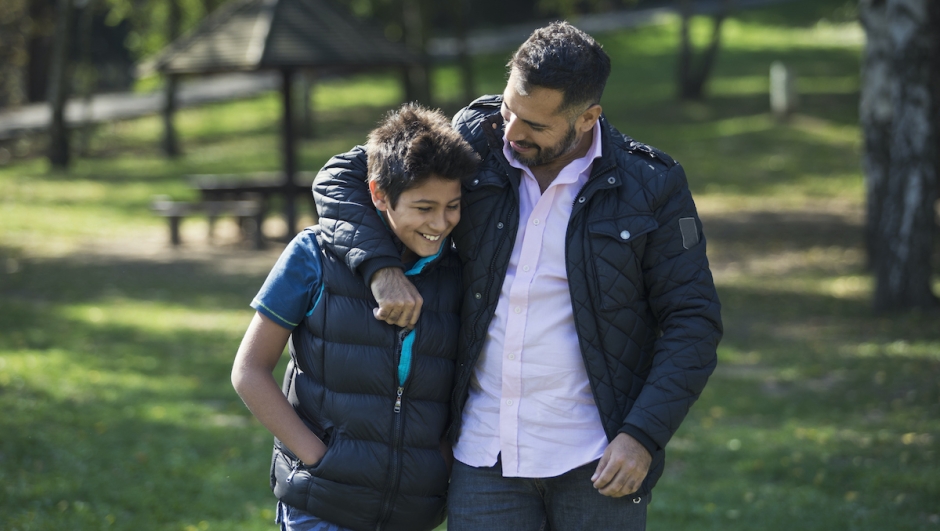 Father and son in public park