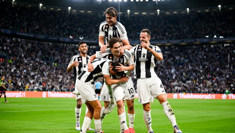 TURIN, ITALY - SEPTEMBER 17: Kenan Yildiz of Juventus celebrates after scoring his team's first goal with teammates Andrea Cambiaso, Dusan Vlahovic and Federico Gatti during the UEFA Champions League 2024/25 League Phase MD1 match between Juventus and PSV Eindhoven at Juventus Stadium on September 17, 2024 in Turin, Italy. (Photo by Daniele Badolato - Juventus FC/Juventus FC via Getty Images)